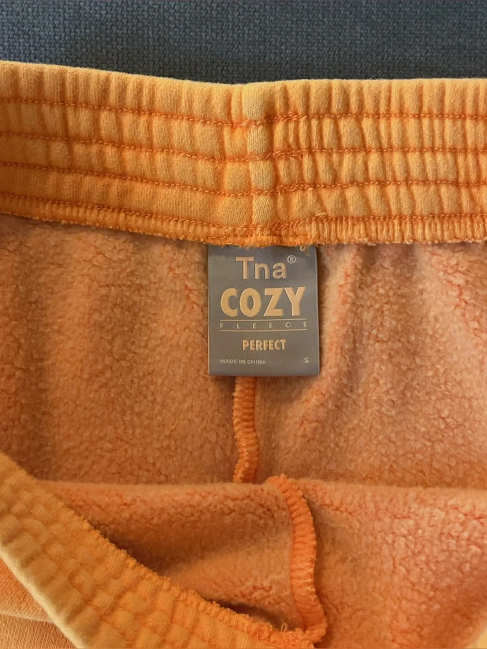 Aritzia Cozy Fleece orange shorts